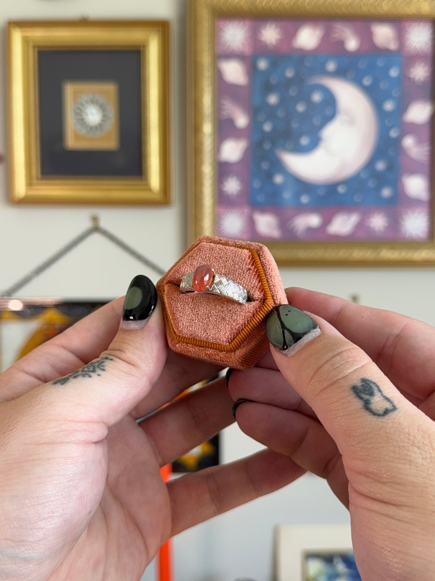 Orange cabochon star sapphire ring