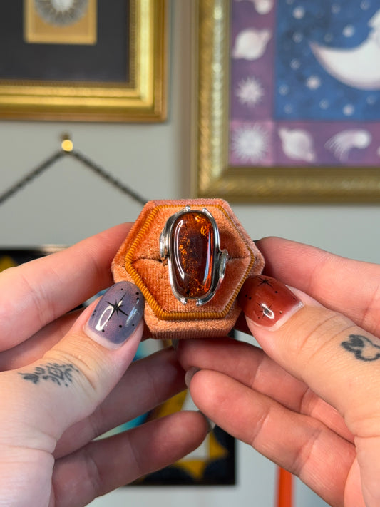 Modernist amber ring with floral detail