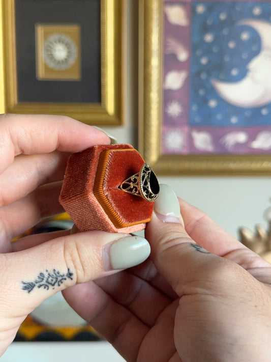 Pear shaped black onyx with filigree gold