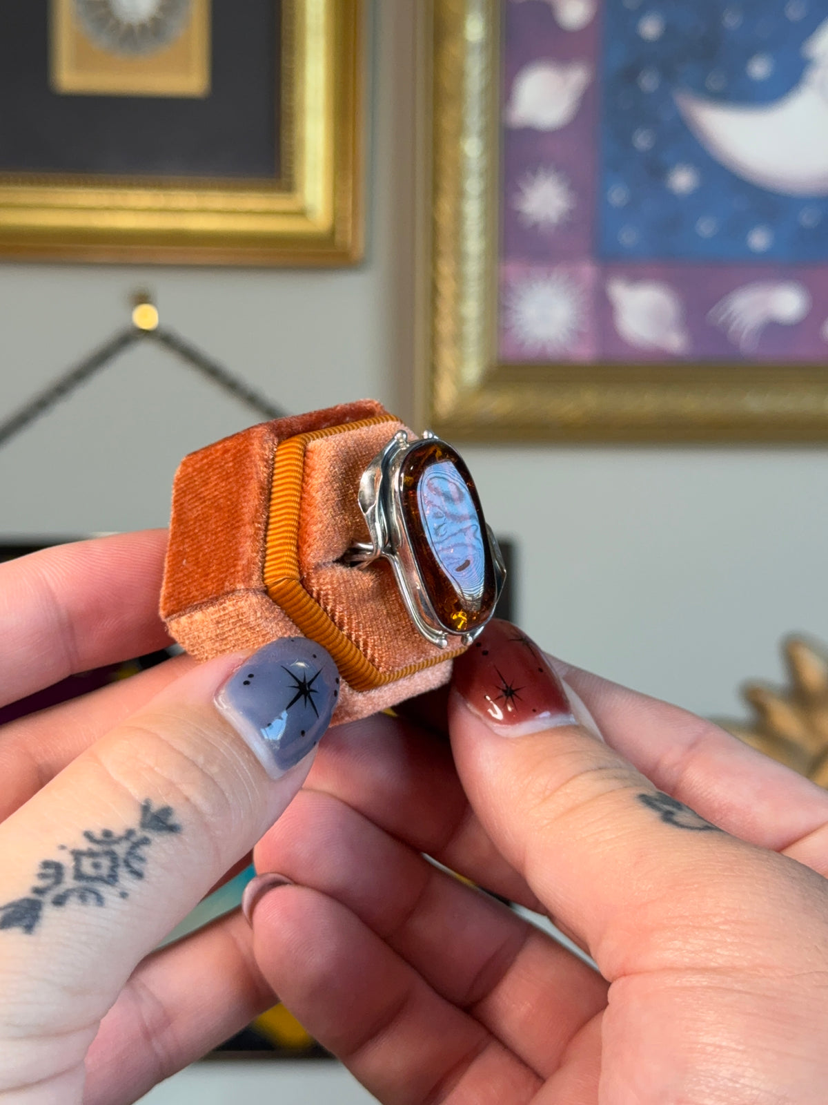 Modernist amber ring with floral detail