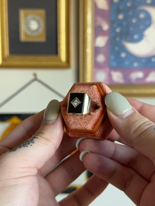 Gold rectangular black onyx signet with diamond motif