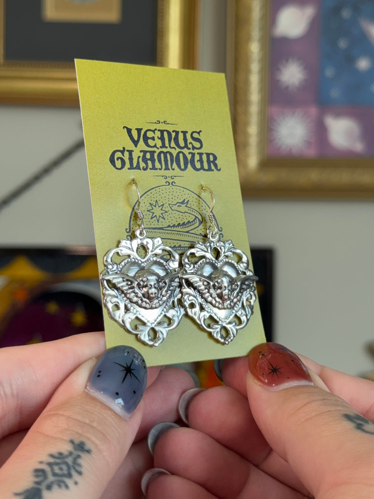 Cherub shield earrings