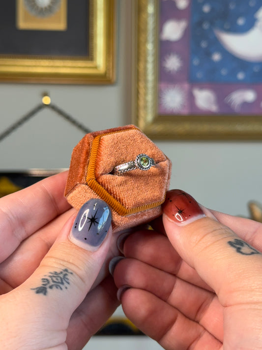 Small twisted peridot ring