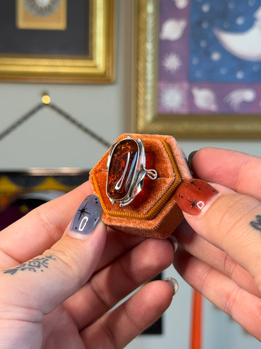Modernist amber ring with floral detail