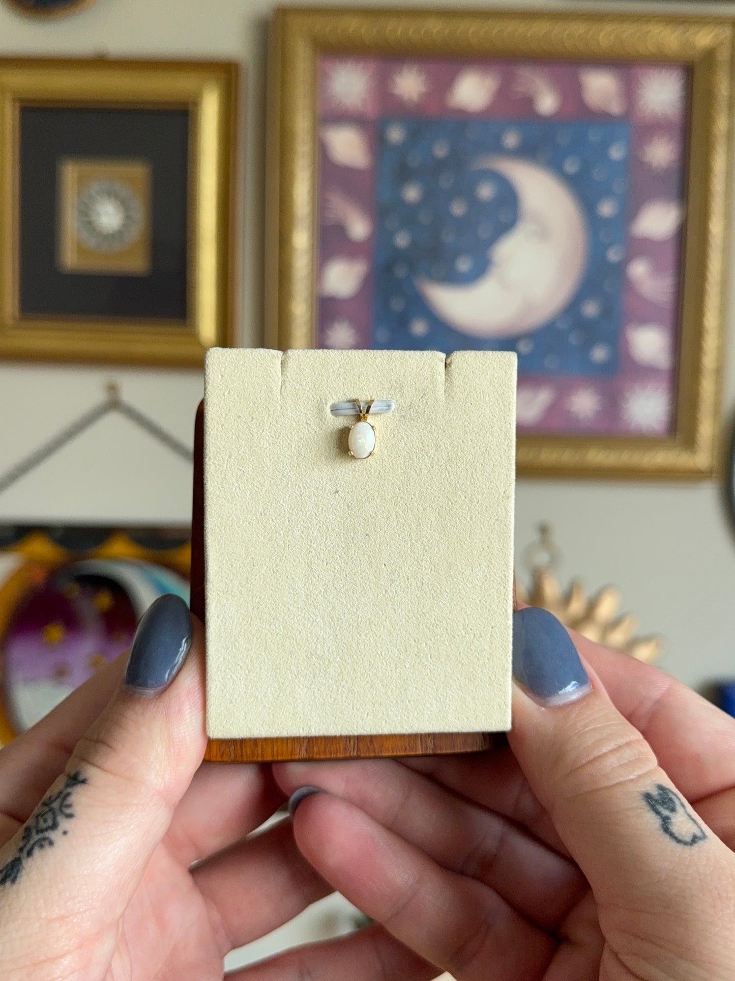 Gold oval opal pendant
