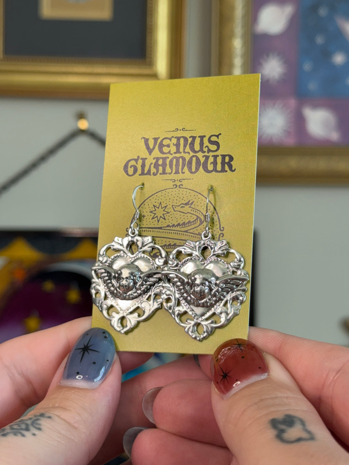 Cherub shield earrings