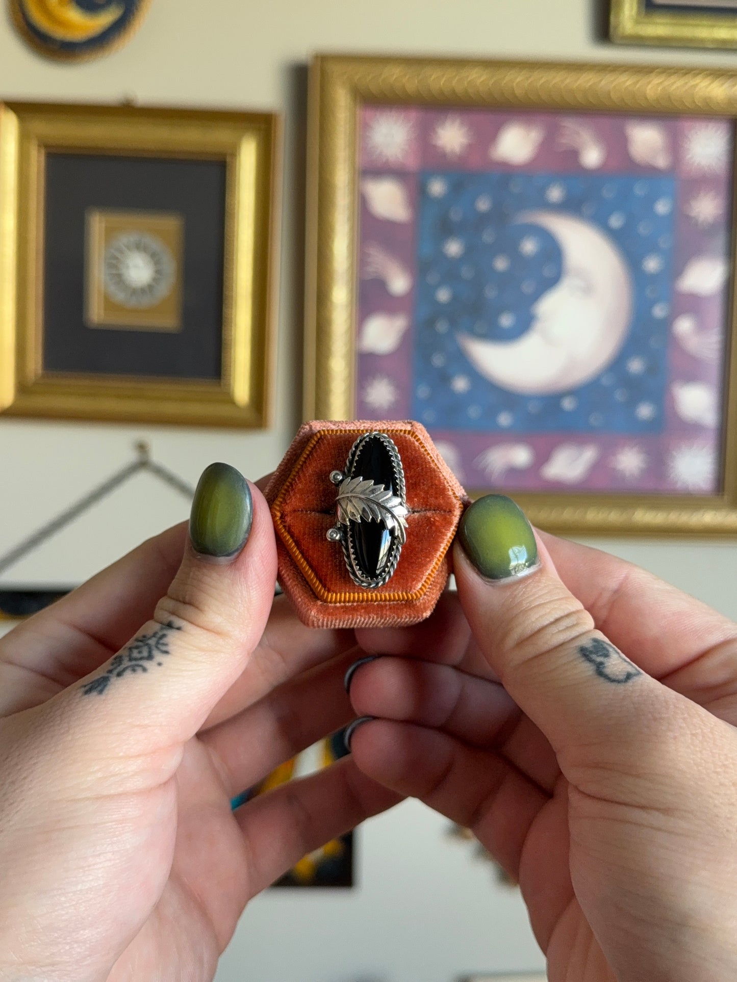 Elongated black onyx with leaf motif