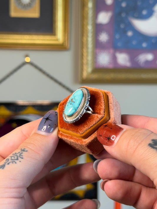 Elongated turquoise ring with detailed bezel